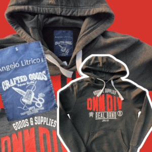 Dark grey Angelo Litrico pullover hoodie with a red DNMDIV graphic, size men's small.