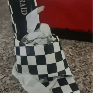 Black and white checkerboard heel mule sandal by Raid with open toe and block heel.